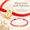 Produktdetails des Babyarmbands aus Gold 585 mit Herz und Kreuz am roten Band