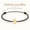 Kinderarmband mit Engel aus Gold, stufenlos verstellbar dank Schiebeknoten, schwarze Kordel